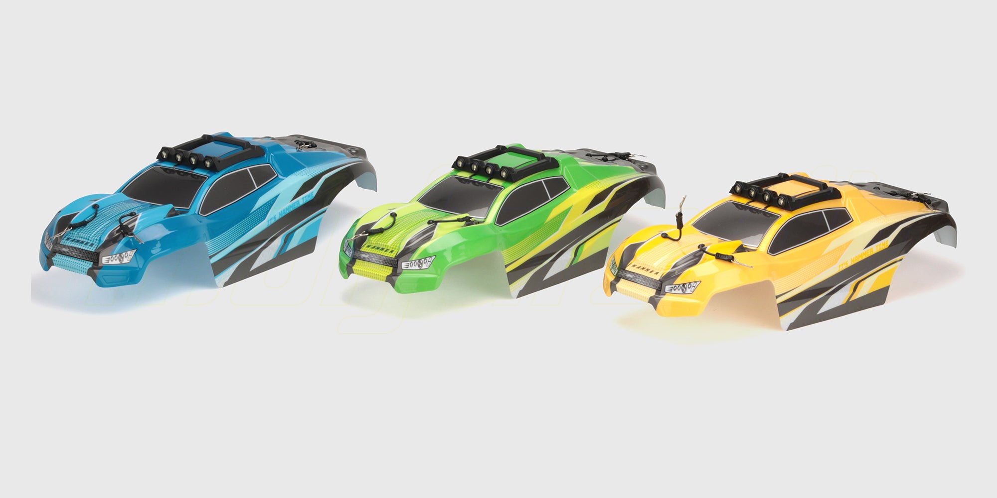 Gult Hammer Body karrosseri til fjernstyret monster truck med sorte detaljer og ruder.