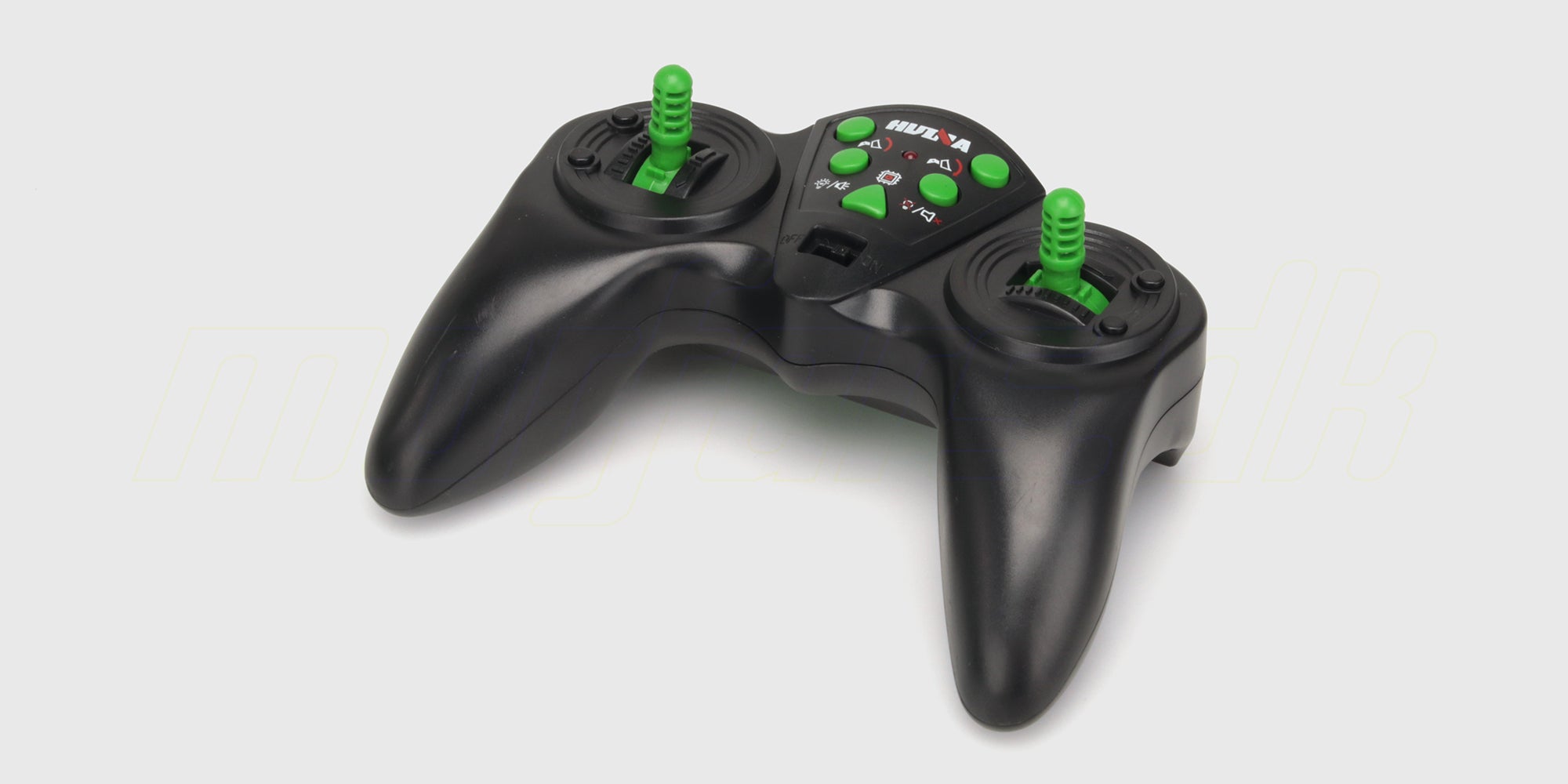 Sort fjernbetjening med joystick og knapper til styring af en gul fjernstyret rendegraver.