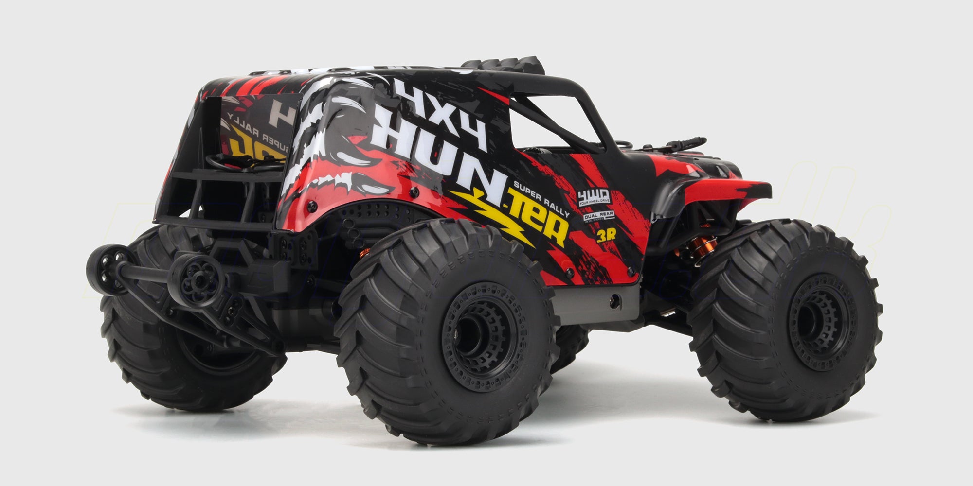 Rød Hurricane XL Monster Truck med store offroad-hjul og affjedring set skråt forfra på hvid baggrund.