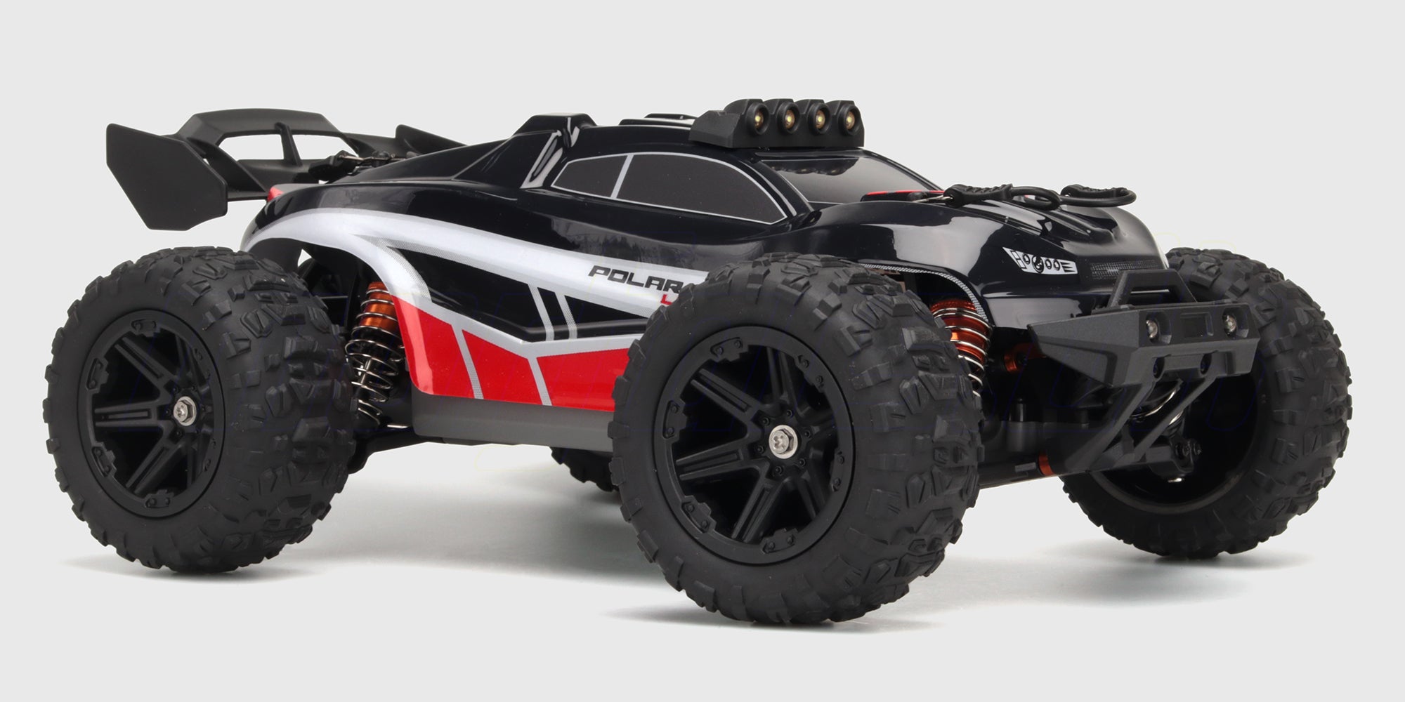 Hurricane XL monster truck i blå og hvid med store offroad dæk vist skråt forfra på hvid baggrund.