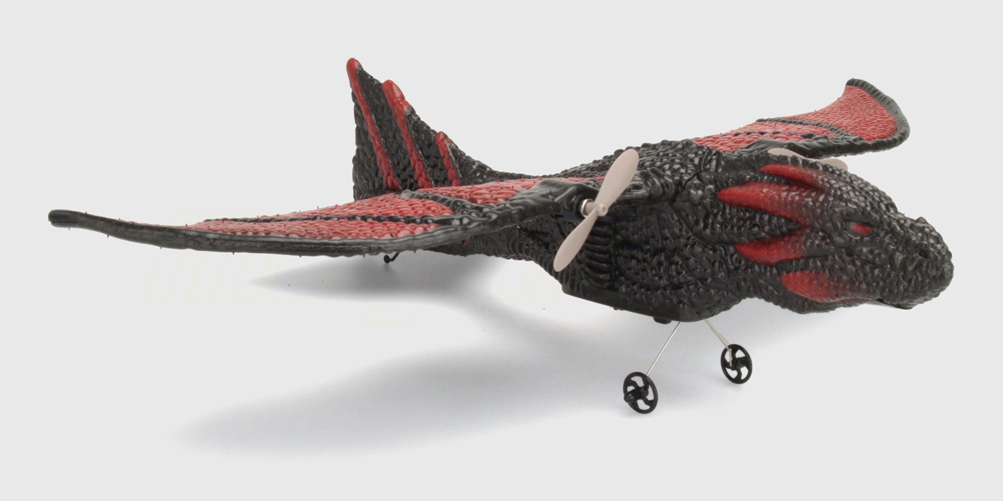 Grøn og orange Flying Animal drage i plast med bevægelige vinger til legende børn.