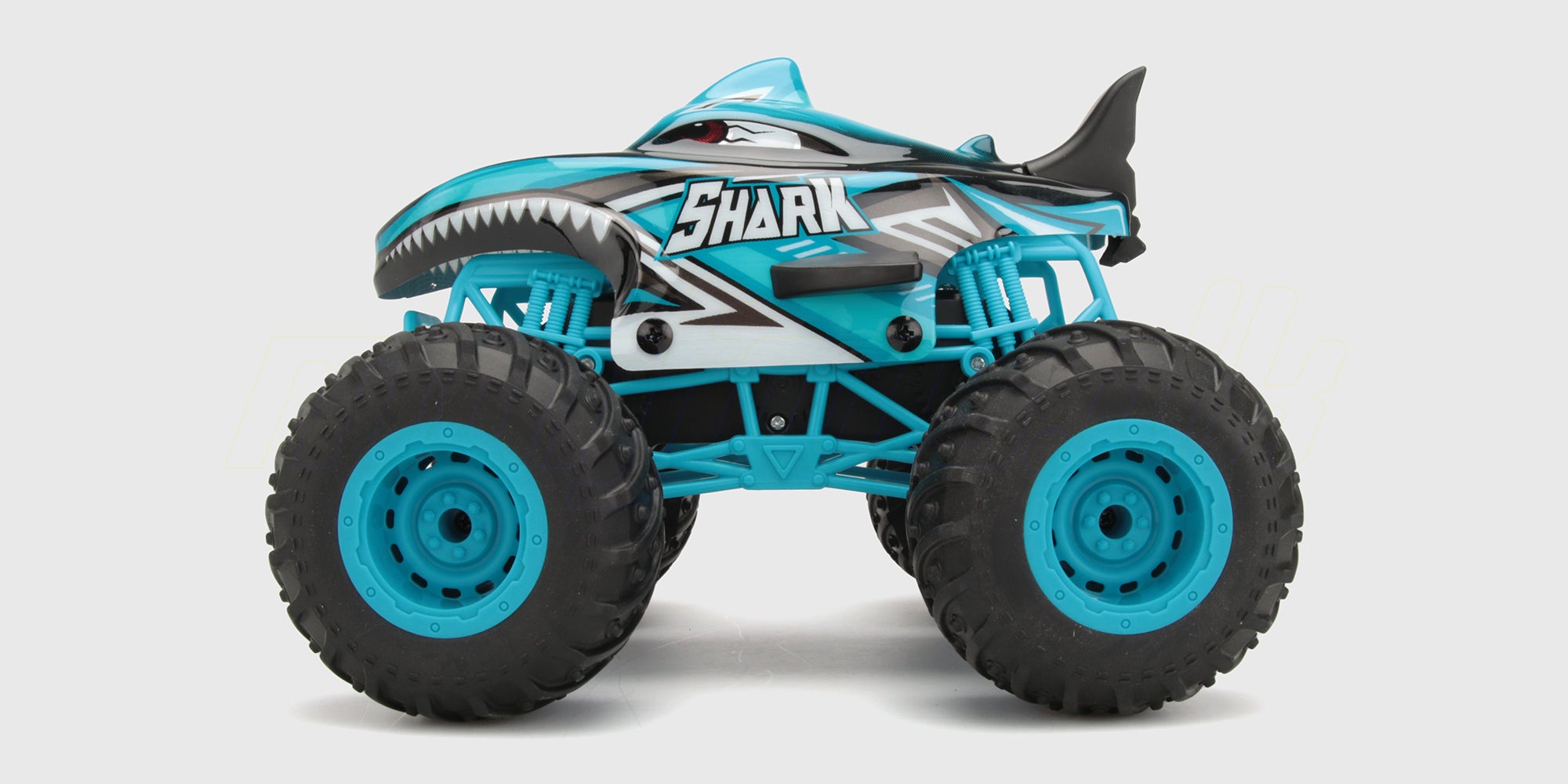 Flash4 Monster Truck i hajhaj-design kører på baghjulene med gyro-balance på en vej.