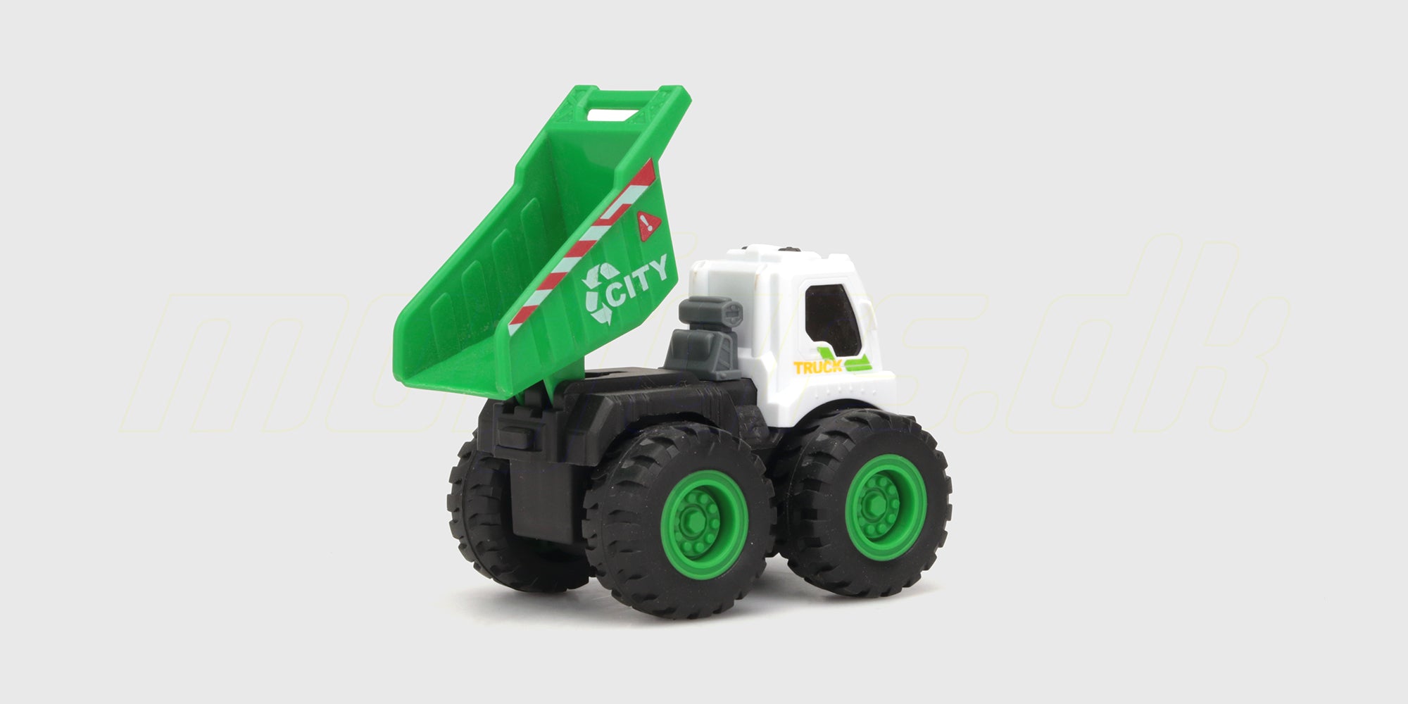 Gul Micro Monster friktionsbil i form af en gravko med store dæk klar til leg på hvid baggrund.