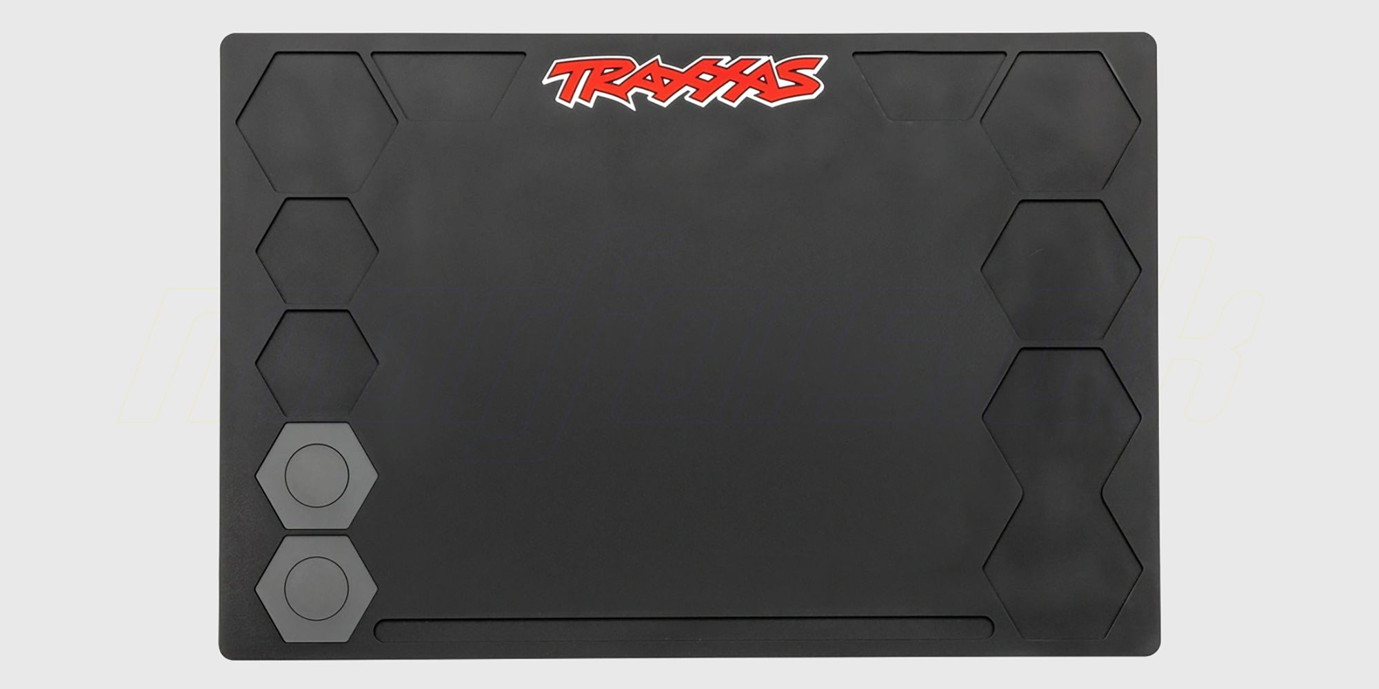 Sort Traxxas pit-måtte med opdelte sektioner til organisering af skruer og dele til fjernstyrede biler.