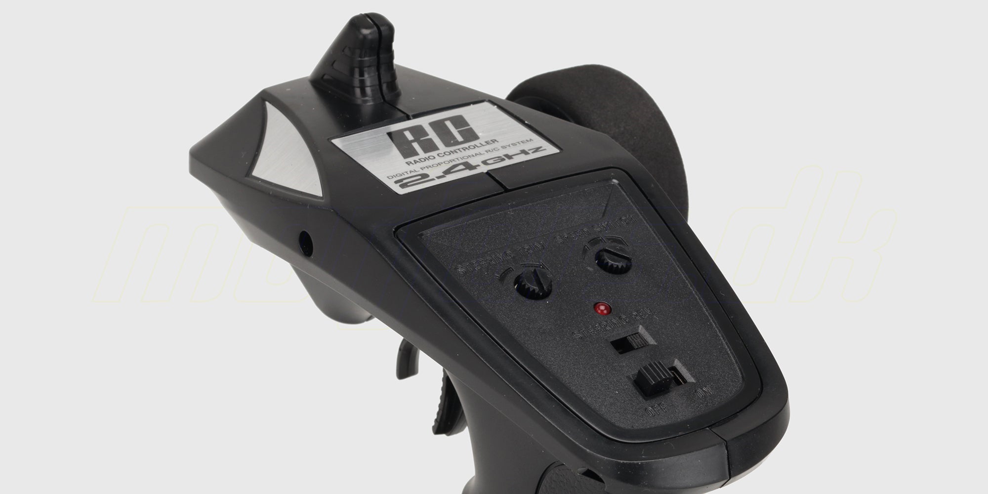 Sort HBX radiosender med pistolgreb og rat til styring af fjernstyrede Ravage biler.