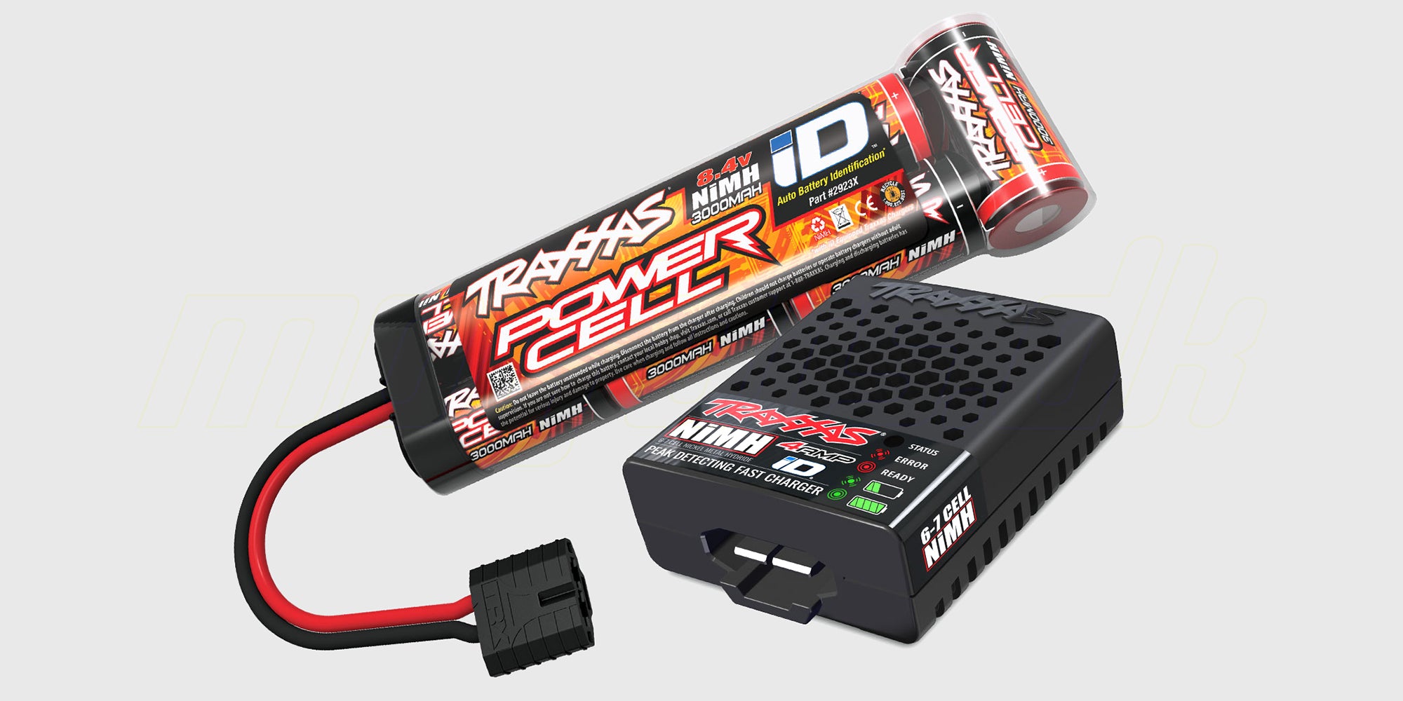 Blå Traxxas Rustler fjernstyret stadium truck med USB-oplader og batteri vist på hvid baggrund.