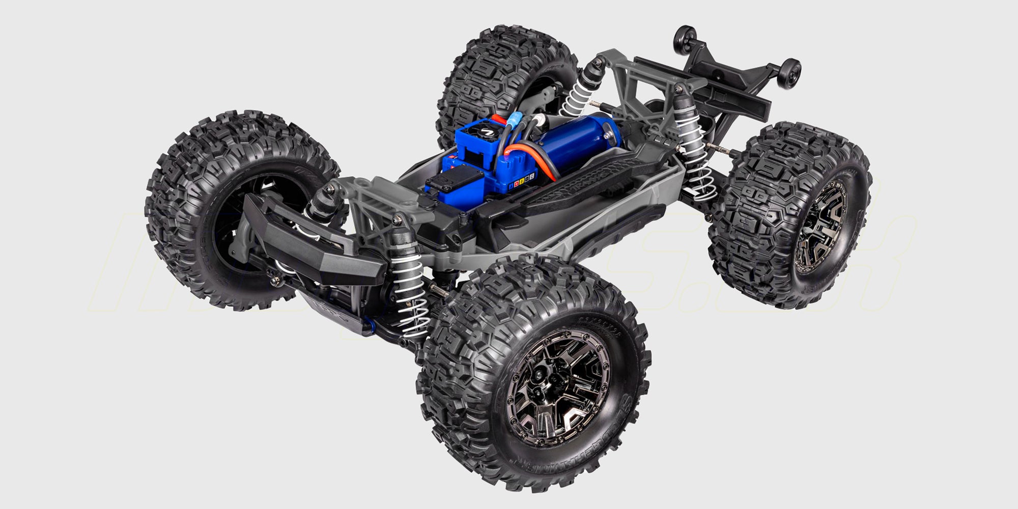 Orange Traxxas Stampede 4x4 VXL monster truck med store offroad dæk og kraftig affjedring set forfra.