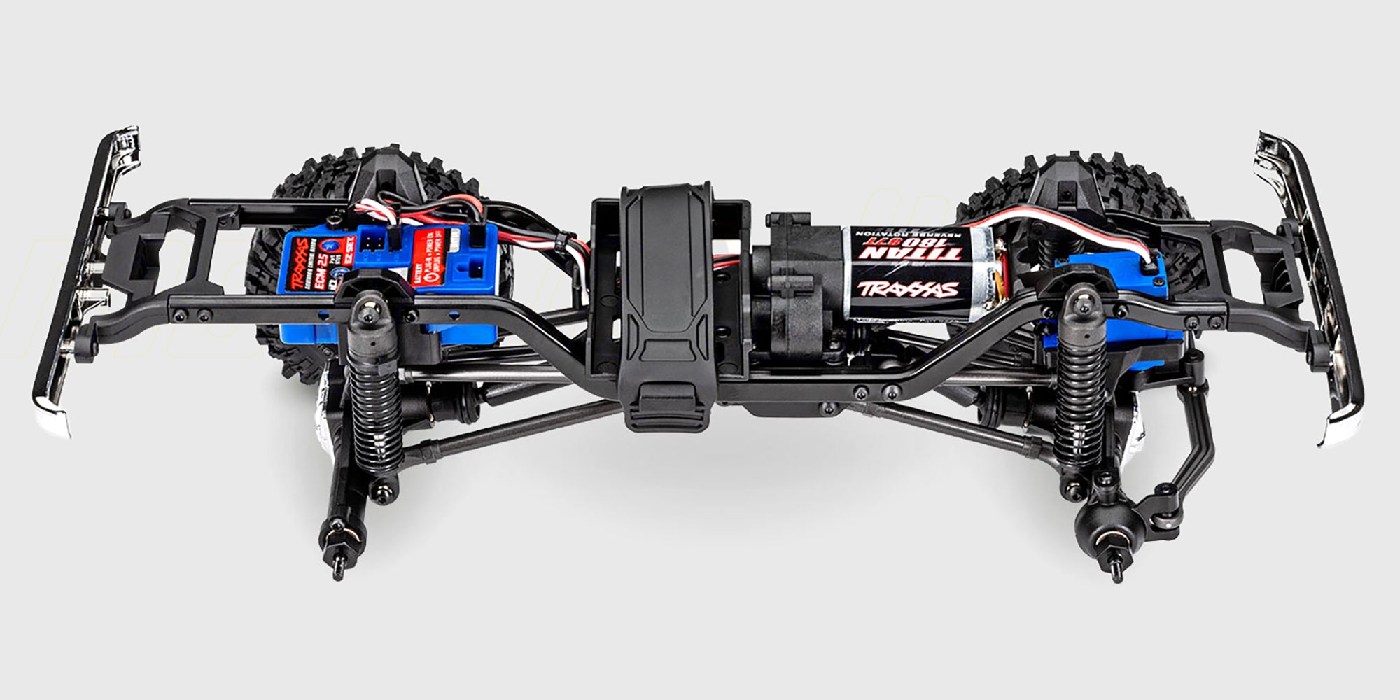 Rød Traxxas TRX-4M Chevrolet K10 fjernstyret crawler vist i profil med detaljeret karrosseri.