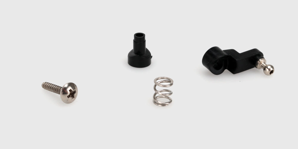 Sort servo saver assembly i plast til Hurricane fjernstyret bil vist på en hvid baggrund.