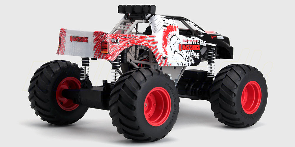 Sort Quakeshock fjernstyret monster truck med store offroad-hjul og robust karrosseri vist på hvid baggrund.