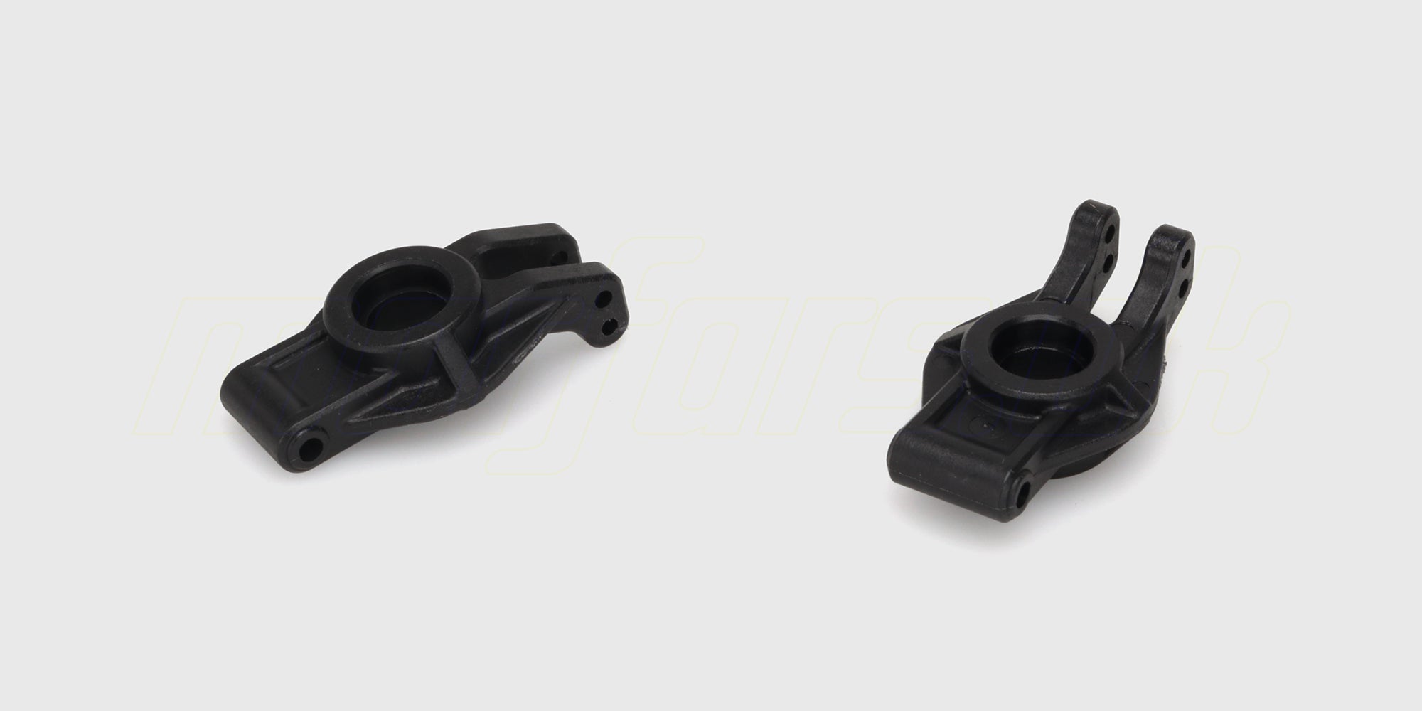 To sorte Tornado rear hub carriers i plast til baghjulsophæng på en HBX fjernstyret bil.