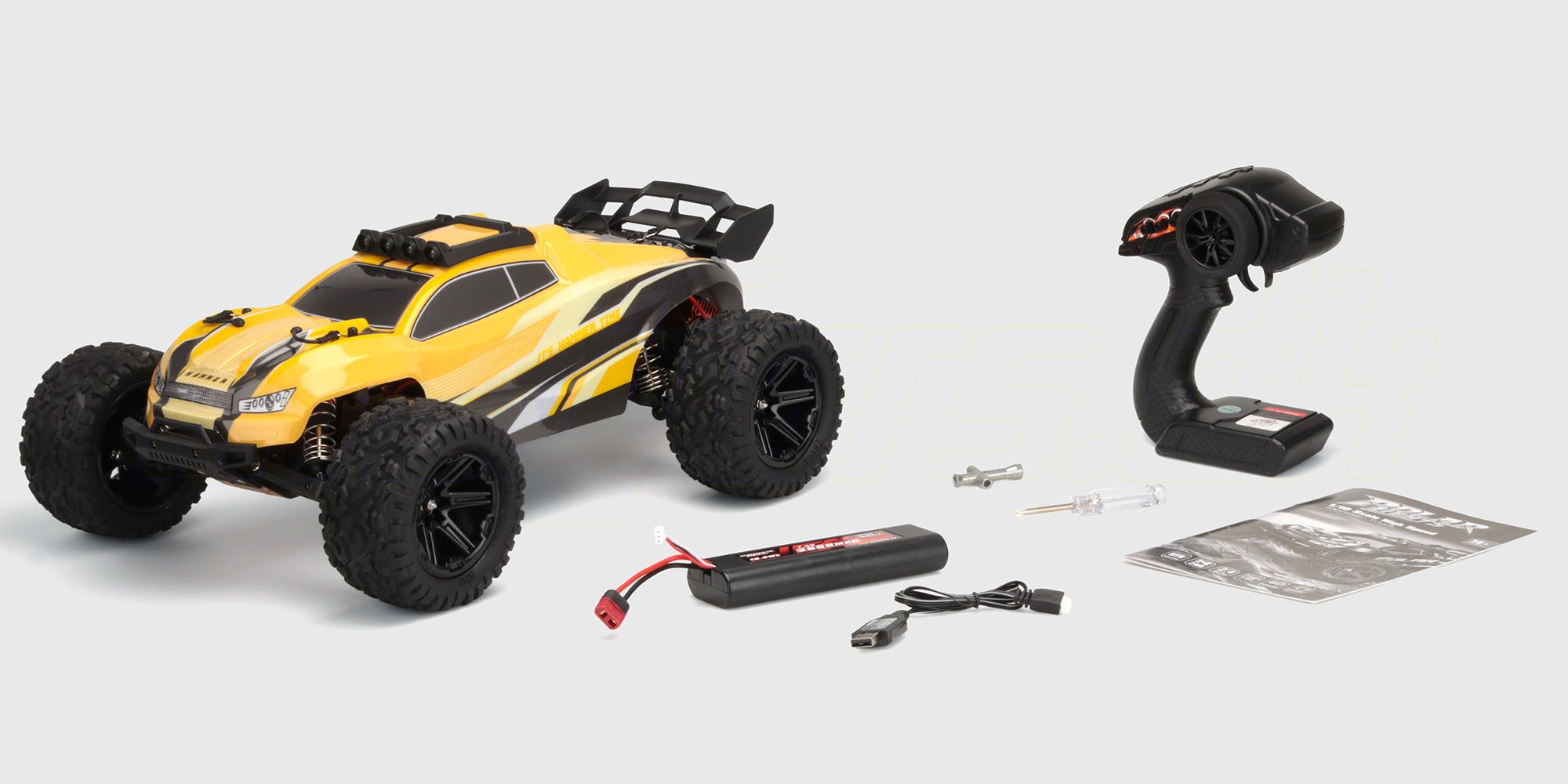 Hammer med rødt og sort gummigreb i en gennemsigtig opbevaringskasse til værktøj.