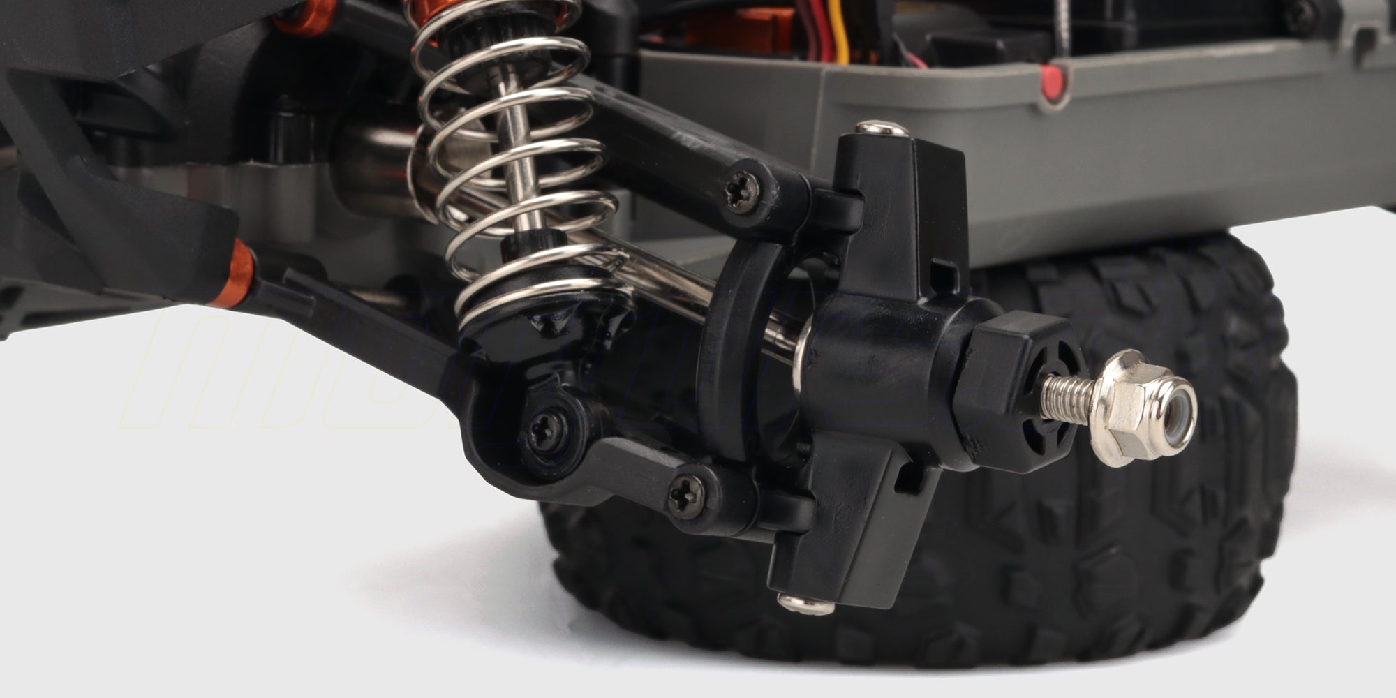 Hurricane XL Brushless fjernstyret bil i hvid og blå set forfra med kraftige offroad-dæk.