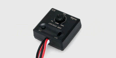 Sort HyperGo gyro-enhed til drift-kontrol af fjernstyrede biler vist på en hvid baggrund.