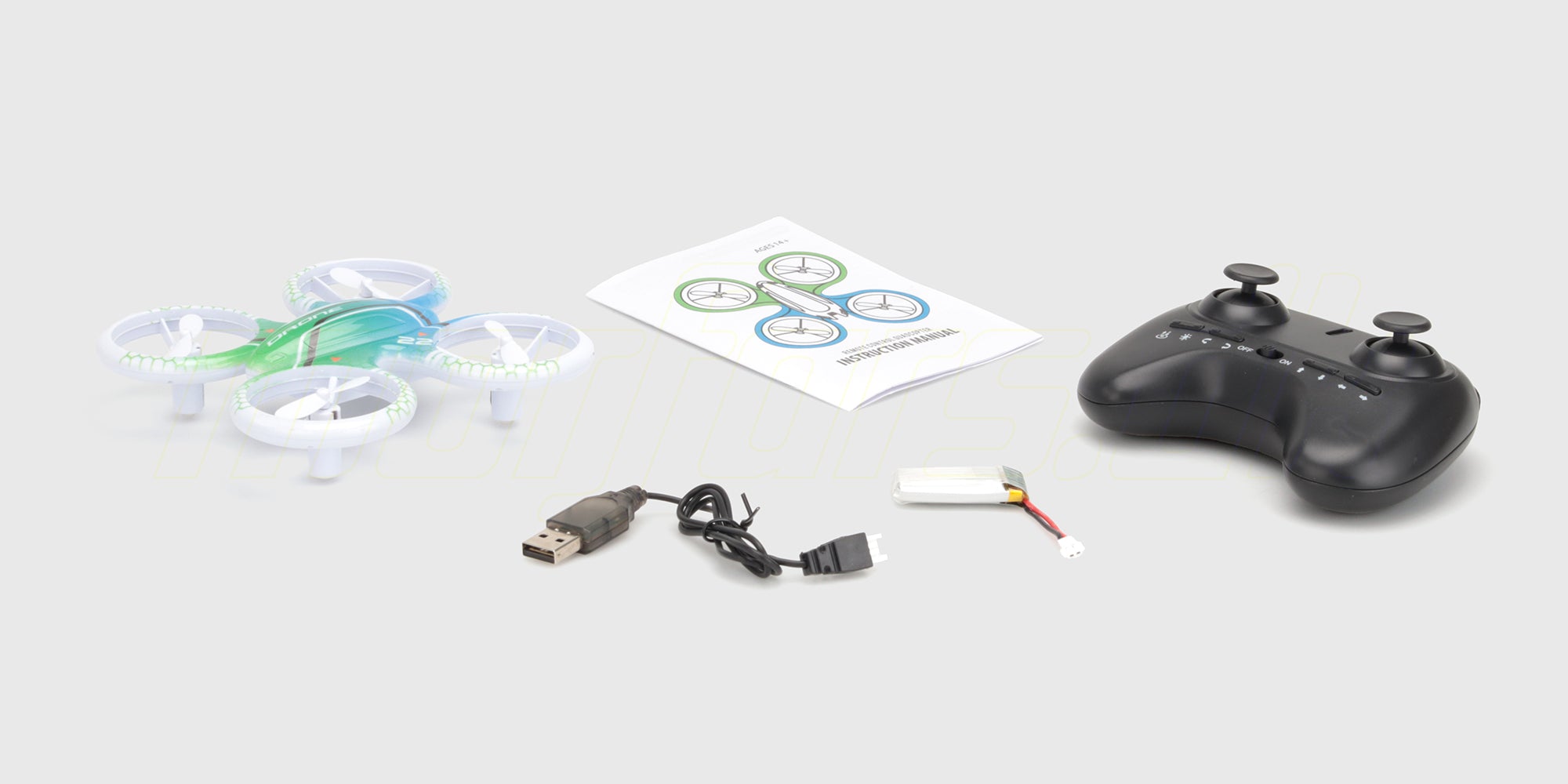 Drone Super Glow stunt-drone med grønt LED-lys og sort propelbeskyttelse flyvende mod en mørk baggrund.