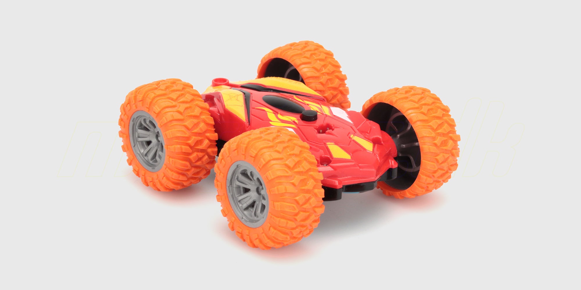 Grøn Mini Stunt Car fjernstyret bil med store hjul, der kan køre på begge sider og lave vilde flips.