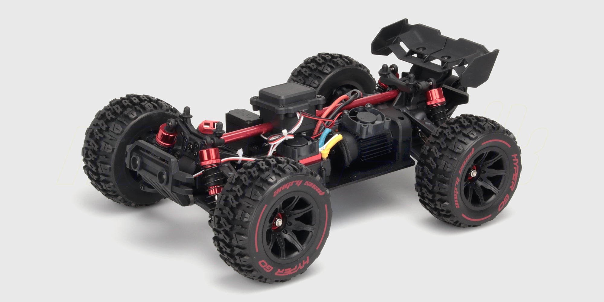 HyperGo EXtreme fjernstyret bil i sort og grøn med store offroad-hjul vist fra siden på en hvid baggrund.