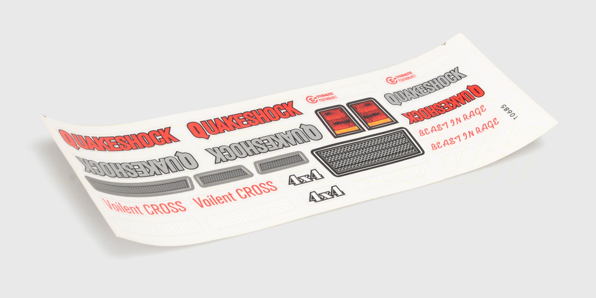 Ark med Quakeshock klistermærker og logoer til styling af fjernstyrede biler vist på hvid baggrund.