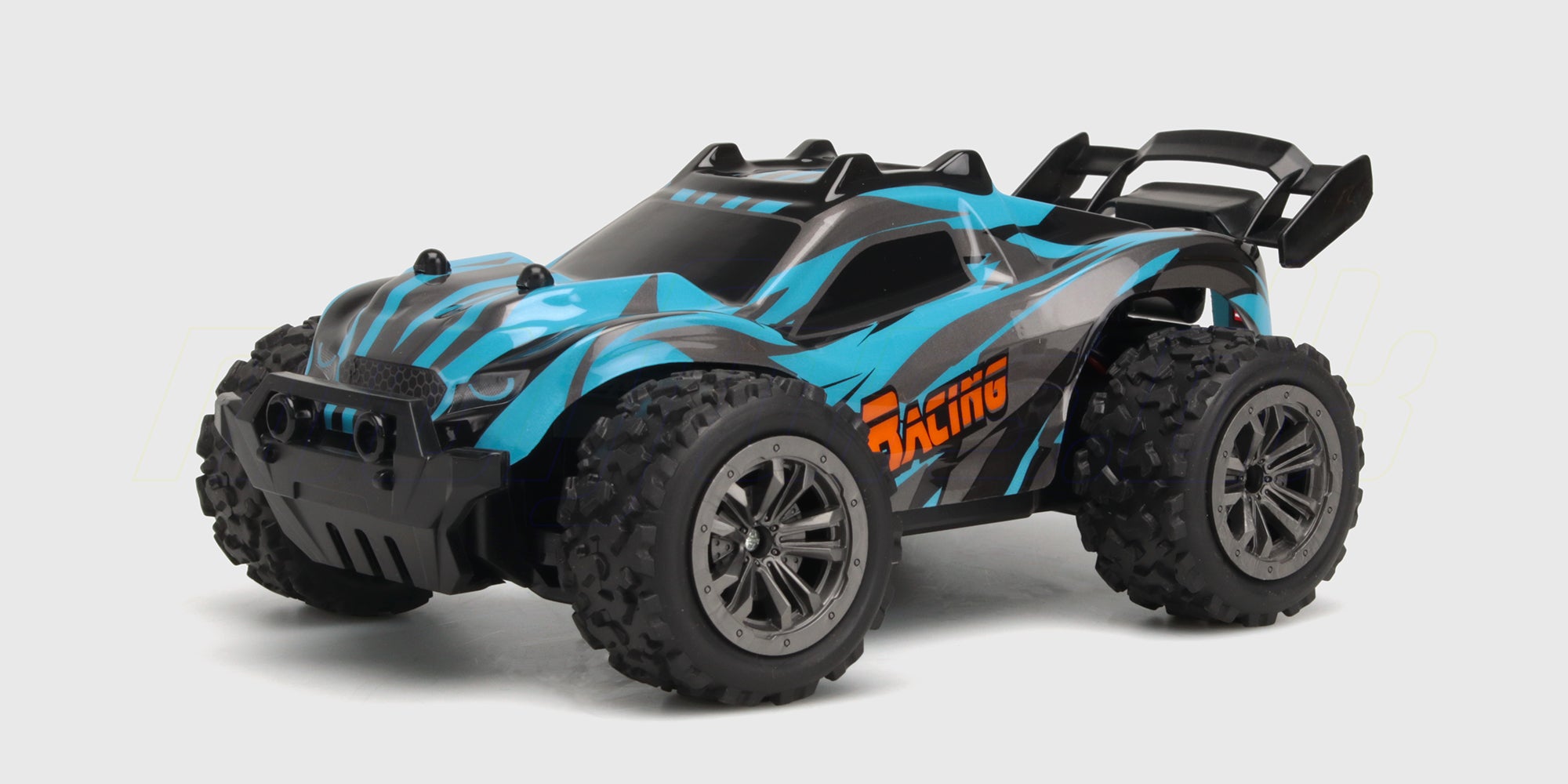 Orange Rapid Monster Truck fjernstyret bil med store terrængående dæk set fra siden.