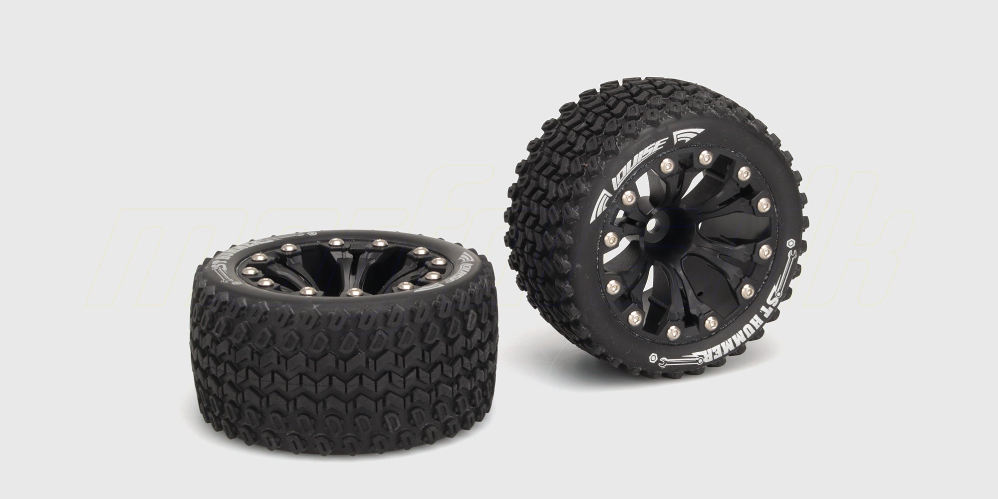 To sorte ST-Hummer offroad-hjul med sorte fælge og grove dækmønstre til fjernstyrede biler.