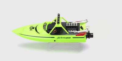 Hvid Storm V8 Superboat fjernstyret speedbåd med røde detaljer i fuld fart på vandet.