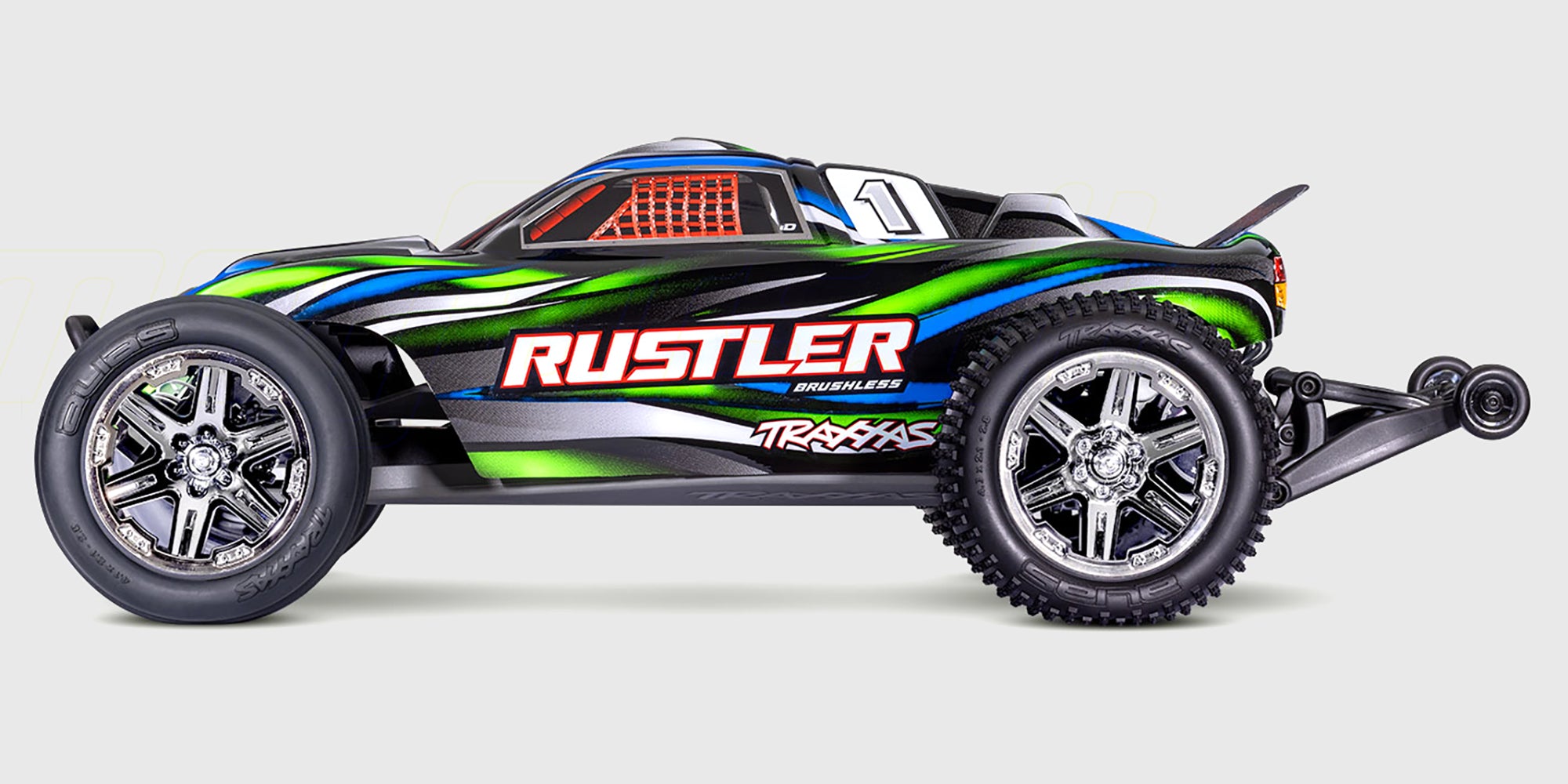 Blå Traxxas Rustler BL-2s fjernstyret bil med brushless motor og offroad dæk set forfra på hvid baggrund.