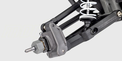 Traxxas Stampede 2WD monster truck i blå og hvid med store offroad dæk set fra siden.