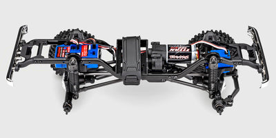 Rød Traxxas TRX-4M Chevrolet K10 fjernstyret crawler vist i profil med detaljeret karrosseri.