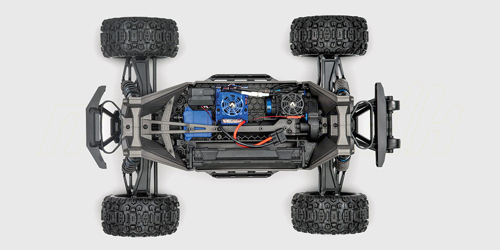 Chassis set oppefra af Traxxas Maxx Widemaxx monster truck med blåt karrosseri og robust affjedring.