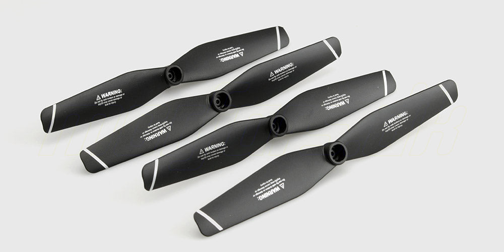 To sorte propeller til STX6 drone vist på hvid baggrund som reservedele.