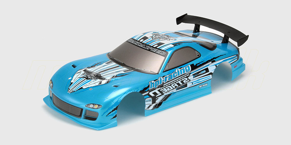 Gult Mazda RX-7 FD3S karrosseri i 190mm til fjernstyret bil set forfra på hvid baggrund.