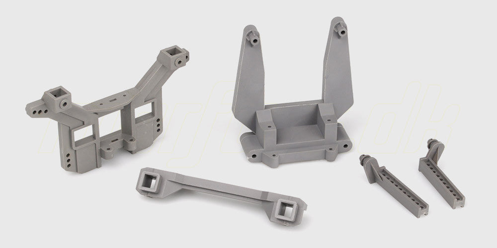 Sort støddæmpertårn og karrosseriholder i plast til fjernstyret bil.