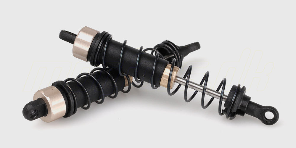 To sæt sorte frontstøddæmpere med fjedre monteret til fjernstyret bil.