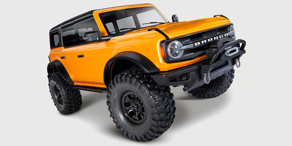 Traxxas TRX-4 fjernstyret crawler med orange 2021 Ford Bronco karrosseri i 1:10 skala.