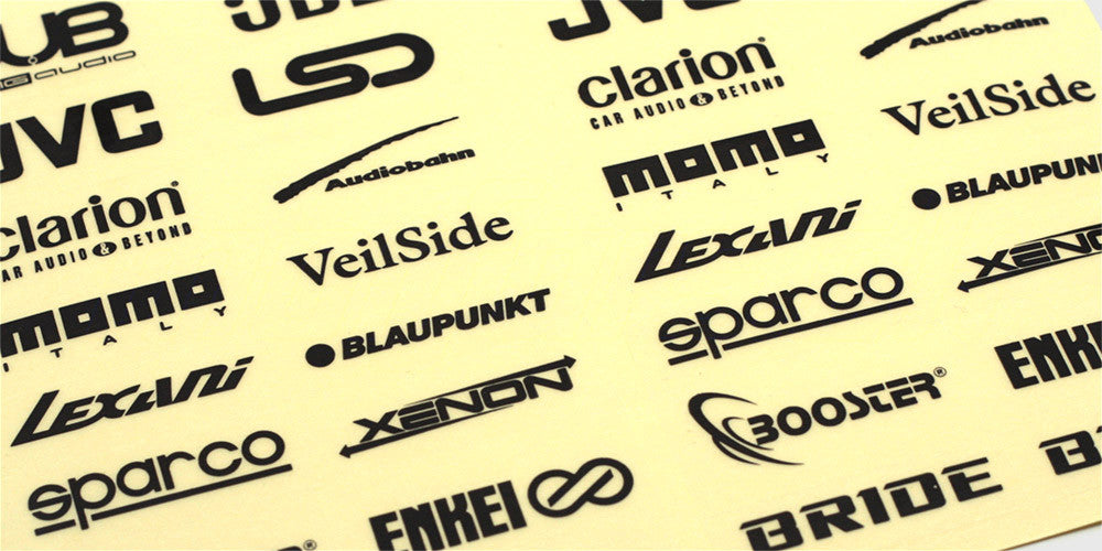 Klistermærker Stylez med sorte logoer som DUB og JBL på et gennemsigtigt ark til fjernstyrede biler.